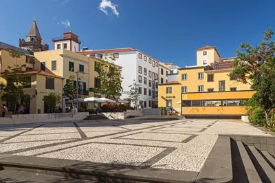 an empty street in a city with buildings at Elias Garcia II by An Island Apart in Funchal