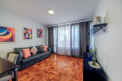 a living room with a couch and a table at Apartamento Vista Oceano in Caniço