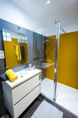 a bathroom with a sink and a shower at Apartamento Vista Oceano in Caniço