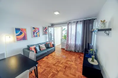 a living room with a couch and a table at Apartamento Vista Oceano in Caniço