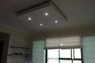 a kitchen with a ceiling with a window and a window shade at Cozy and Bright Apartment in Machico