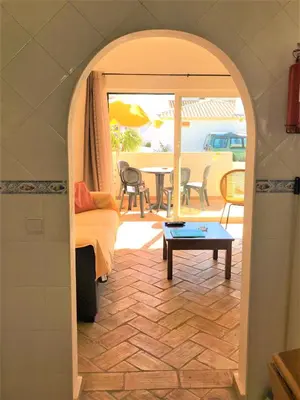 a living room with a couch and a table at Casas da Vila in Luz
