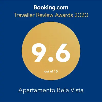 a yellow circle with the number nine and the text travelling review awards at Apartamento Bela Vista in Porto Santo