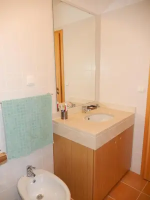 a bathroom with a sink and a mirror at Apartamento Bela Vista in Porto Santo