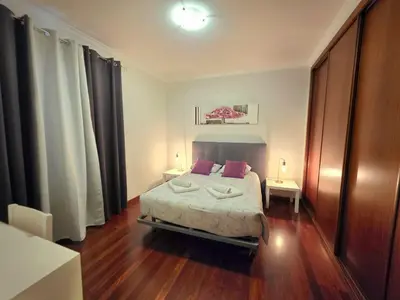 a bedroom with a bed with two pillows on it at Colinas do Lido III by Rentallido in Funchal