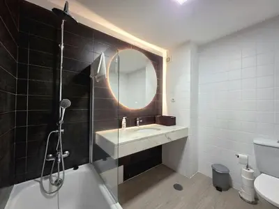 a bathroom with a sink and a mirror at Colinas do Lido III by Rentallido in Funchal
