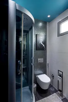 a bathroom with a glass shower and a toilet at Villa São Lourenço in Fajã da Ovelha