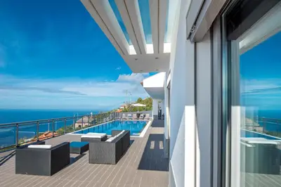 a balcony with a view of the ocean at Villa São Lourenço in Fajã da Ovelha