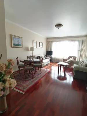 a living room with a couch and a table at Ladeira Centro in Funchal