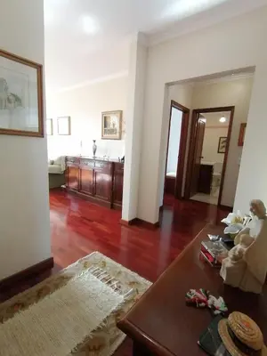 a living room with a couch and a table at Ladeira Centro in Funchal