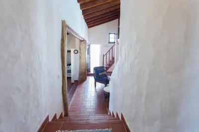 a hallway of a house with a stairway at Casas da Capela do Monte, Country Houses in Lagos