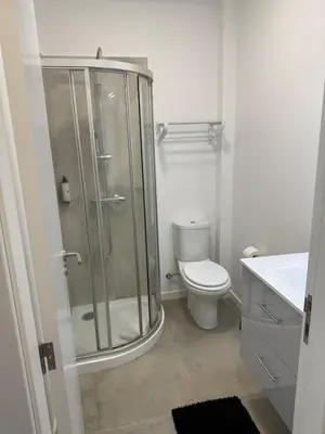 a bathroom with a shower and a toilet at Canavial Terrace@Heart of Funchal in Funchal