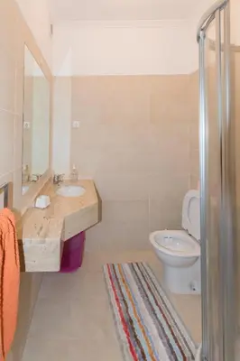 a bathroom with a sink and a toilet at Quinta da Torre in Câmara de Lobos