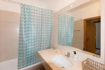 a bathroom with a sink and a mirror at Quinta da Torre in Câmara de Lobos