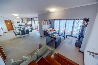 an aerial view of a living room and dining room at Casa Falésia in Caniço