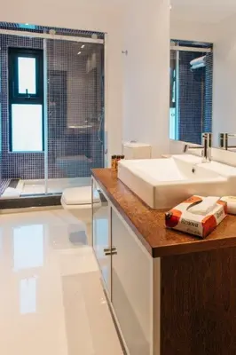 a bathroom with a sink and a toilet at Vilas Mediterrâneo in Santa Cruz