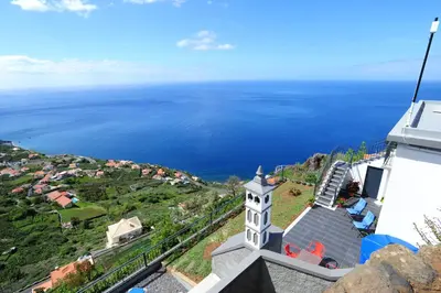 a view of the ocean from a building at Casa Horizonte in Arco da Calheta