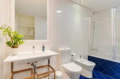 a bathroom with a toilet and a sink at Casa da Praça Apartments - by Casas na Ilha in Funchal
