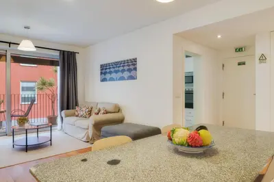 a living room with a bowl of fruit on a counter at Casa da Praça Apartments - by Casas na Ilha in Funchal