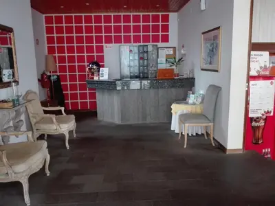 a restaurant with a counter and a table and chairs at Estalagem Corte do Norte in Ponta Delgada