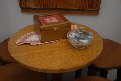 a wooden table with a box on top of it at Olivia's Place in Funchal