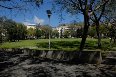 a light pole in a park with a grass field at Olivia's Place in Funchal