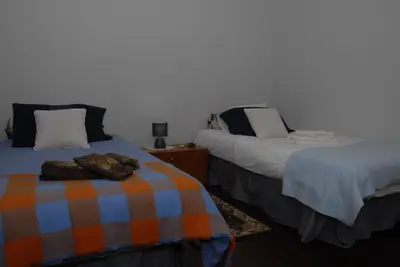 a bedroom with two beds with a blanket on the bed at Olivia's Place in Funchal