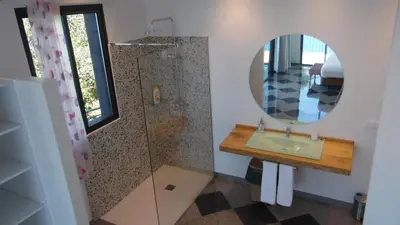 a bathroom with a sink and a mirror at Ocean Cliff in Ponta do Sol