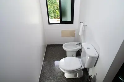 a bathroom with a toilet and a bidet at Ocean Cliff in Ponta do Sol