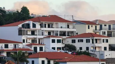 a group of white houses with red roofs at Murteiras Living in Funchal