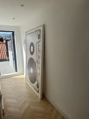 a large speaker in a corner of a room at Rooftop Apartment city center in Funchal