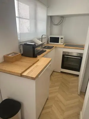 a kitchen with a counter with a phone on it at Rooftop Apartment city center in Funchal
