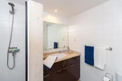 a bathroom with a sink and a shower at Casa dos Avós by Rent2U, Lda in Funchal