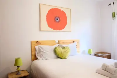 a bedroom with a heart pillow on a bed at Lobos Bay-Apartment With Unique Sea Views in Câmara de Lobos