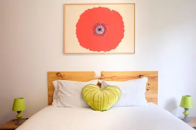 a bedroom with a heart pillow on a bed at Lobos Bay-Apartment With Unique Sea Views in Câmara de Lobos