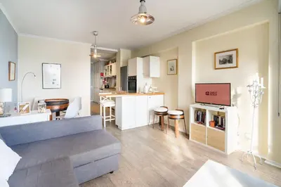 a living room and kitchen with a couch and a table at Barreirinha II Near Old Town With Nice Ocean Views in Funchal