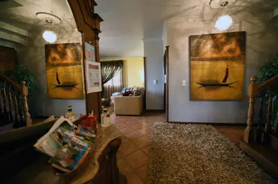 a living room with two paintings on the wall at Ponta do Sol Villa in Ponta do Sol