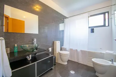 a bathroom with a sink and a toilet and a shower at Casa da Graça by AnaLodges in Machico