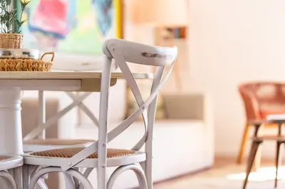 a white chair sitting in front of a table at Lido Mar - Hotels area in Funchal