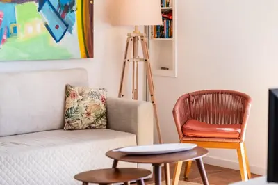 a living room with a couch and a chair at Lido Mar - Hotels area in Funchal