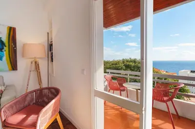 a room with a balcony with a view of the ocean at Lido Mar - Hotels area in Funchal