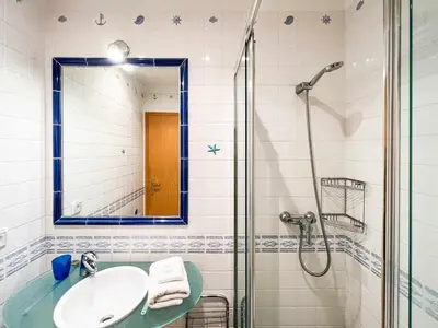 a bathroom with a sink and a shower at Garajau Terrace - Amazing Views of Garajau Town in Garajau