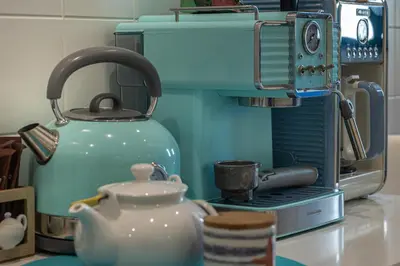 a teapot sitting next to a coffee maker at Atlantic Ocean View Apartment in Funchal
