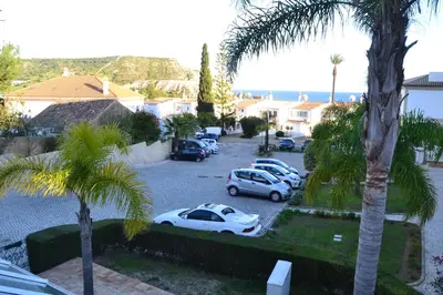 a group of cars parked in a parking lot at Palm Bay Apartment in Luz
