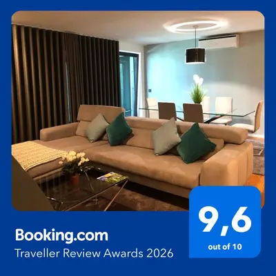 a living room with a glass table and chairs at Astro Madeira Apartments in Funchal