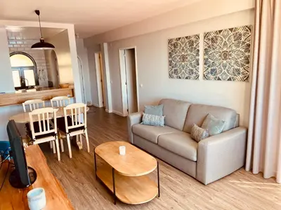 a living room with a couch and a table at Ocean Cliffs Apartments in Funchal