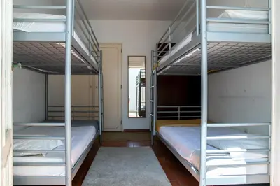 a room with two bunk beds in a room at Beach House at Praia da Luz in Luz