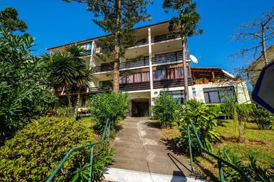 an apartment building with a walkway in front of it at Vista Oceano II in Caniço