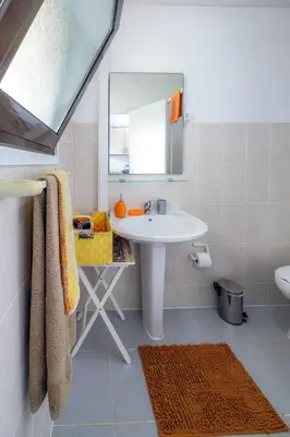a bathroom with a sink and a mirror at Vista Oceano II in Caniço
