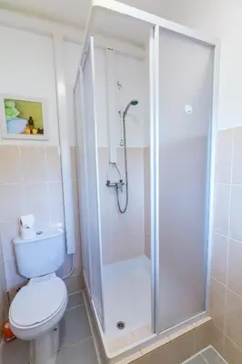 a bathroom with a shower and a toilet at Vista Oceano II in Caniço